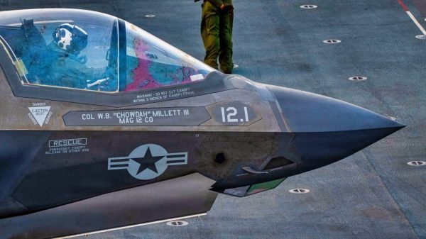 A U.S. Marine conducts pre-flight checks on an F-35B Lighting II, attached to Marine Fighter Attack Squadron (VMFA) 121, on the flight deck of America-class amphibious assault ship USS Tripoli (LHA 7), May 22, 2026. Tripoli is deployed to the U.S. 5th Fleet area of operations to support maritime security and stability in the Middle East. (U.S. Navy photo)