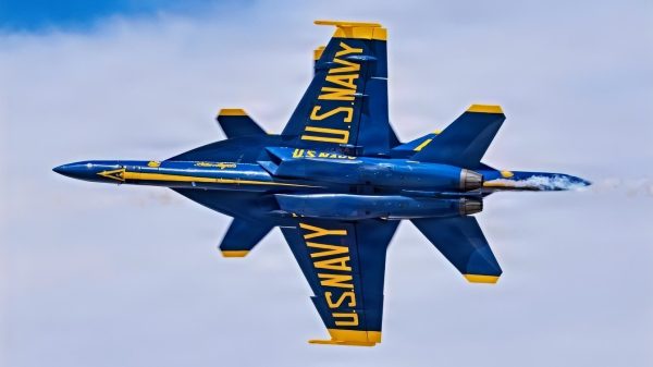 U.S. Navy Blue Angels 5 and 6 fly past each other in an opposing knife edge pass during the Luke Days 2026 airshow, March 22, 2026, at Luke Air Force Base, Arizona. Events like Luke Days 2026 provide insight into the training, preparation and teamwork that enable the joint force to respond quickly and effectively when needed. anytime and anywhere. The U.S. Navy Blue Angels demonstrate the precision, speed and discipline required to operate the F/A-18 Super Hornet, one of the Navy’s frontline carrier-based fighter aircraft. (U.S. Air National Guard photo by Tech. Sgt. Hampton Stramler)