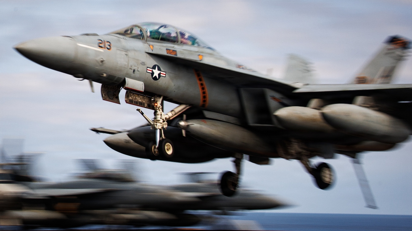 An F/A-18F Super Hornet, attached to Strike Fighter Squadron 213, lands on the flight deck of the world's largest aircraft carrier, USS Gerald R. Ford (CVN 78), while underway in the Mediterranean Sea, April 11, 2026. Gerald R. Ford is on a scheduled deployment in the U.S. 6th Fleet area of operations to support the warfighting effectiveness, lethality and readiness of U.S. Naval Forces Europe-Africa, and defend U.S., Allied and partner interests in the region. (U.S. Navy photo by Mass Communication Specialist 2nd Class Tajh Payne)