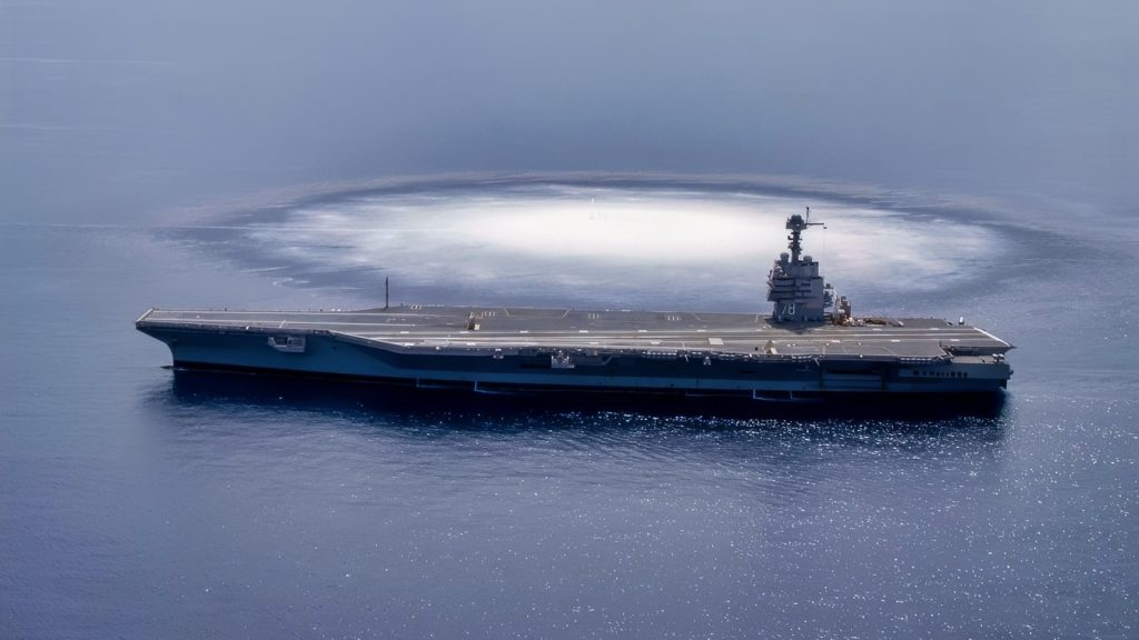 The aircraft carrier USS Gerald R. Ford (CVN 78) completes the first scheduled explosive event of Full Ship Shock Trials while underway in the Atlantic Ocean, June 18, 2021. The U.S. Navy conducts shock trials of new ship designs using live explosives to confirm that our warships can continue to meet demanding mission requirements under harsh conditions they might encounter in battle. (U.S. Navy photo by Mass Communication Specialist 3rd Class Riley B. McDowell)
