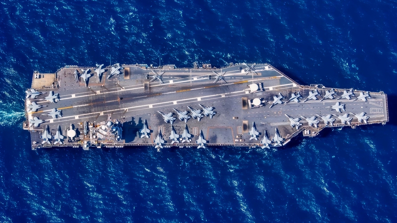The first-in-class aircraft carrier USS Gerald R. Ford (CVN 78) transits the Atlantic Ocean, March 19, 2023. Ford is underway in the Atlantic Ocean executing its Composite Training Unit Exercise (COMPTUEX), an intense, multi-week exercise designed to fully integrate a carrier strike group as a cohesive, multi-mission fighting force and to test their ability to carry out sustained combat operations from the sea. As the first-in-class ship of Ford-class aircraft carriers, CVN 78 represents a generational leap in the U.S. Navy’s capacity to project power on a global scale. (U.S. Navy photo by Mass Communication Specialist 2nd Class Jackson Adkins)