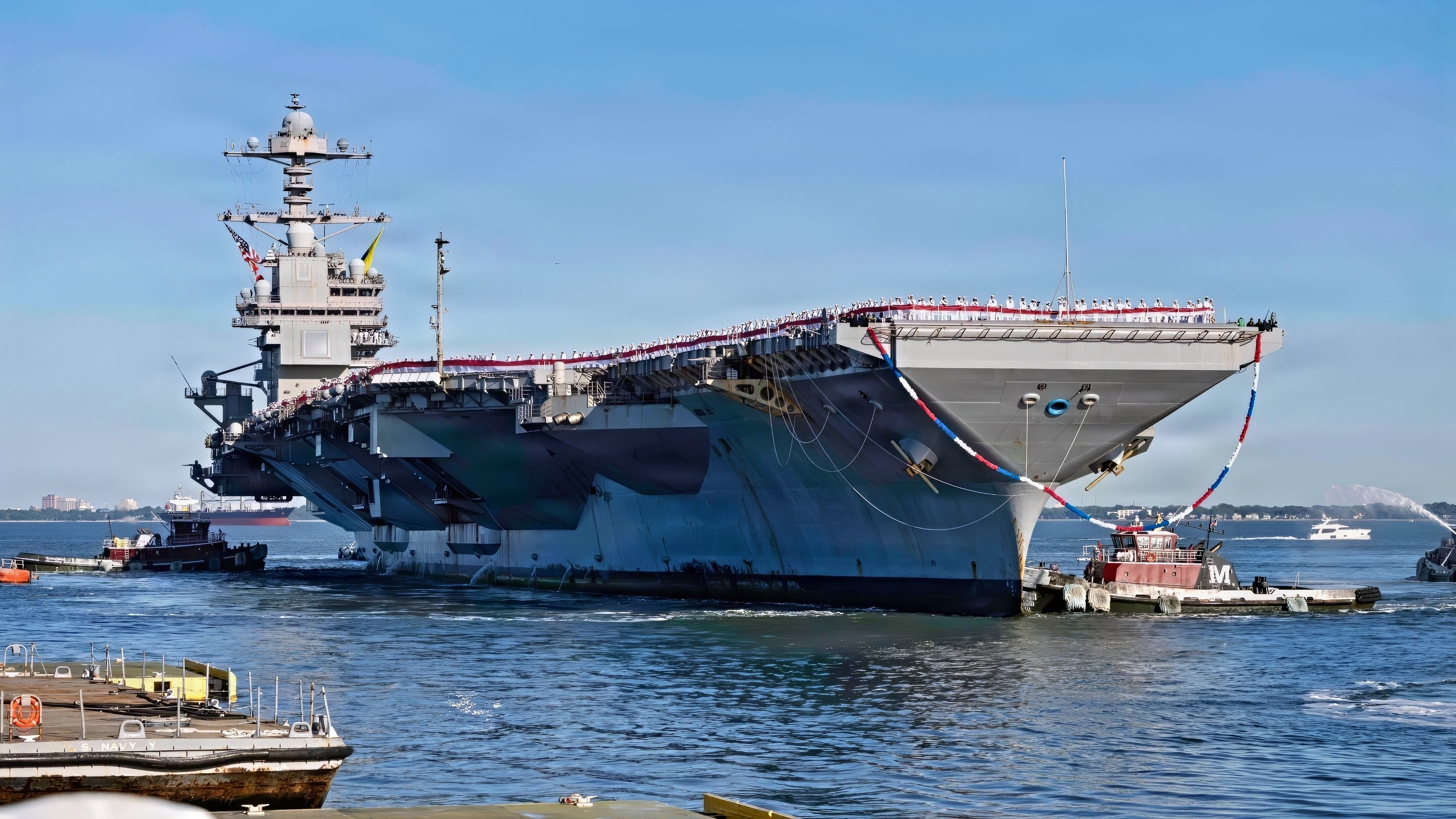 260516-N-EE423-1027 NORFOLK, Va. (May 16, 2026) – The world's largest aircraft carrier, USS Gerald R. Ford (CVN 78), returns to Naval Station Norfolk, May 16, 2026, following a historic 11-month deployment to U.S. 2nd, 4th, 5th, and 6th Fleets as part of the Gerald R. Ford Carrier Strike Group. Before returning to Norfolk after 326 days, the Gerald R. Ford crew conducted 23 replenishments-at-sea, sailed over 57,713 nautical miles, and safely transferred 14 million gallons of fuel. Embarked Carrier Air Wing 8 logged more than 5,760 flight hours and 12,200 flight launches. (U.S. Navy photo by Mass Communication Specialist 1st Class Sophie Pinkham)