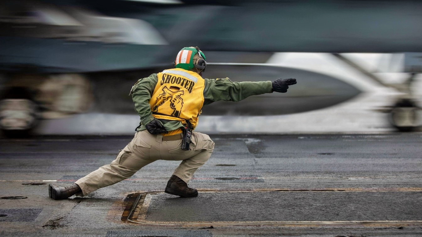 U.S. Navy Lt. Miguel Smith launches an F/A-18E Super Hornet, attached to the "Pukin Dogs" of Strike Fighter Squadron (VFA) 143, from the flight deck of Nimitz-class aircraft carrier USS Dwight D. Eisenhower (CVN 69) May 7, 2026. Eisenhower is underway conducting flight deck certification in the Atlantic Ocean in preparation for future operations. (U.S. Navy photo by Mass Communication Specialist 3rd Class Jamison Sutton)