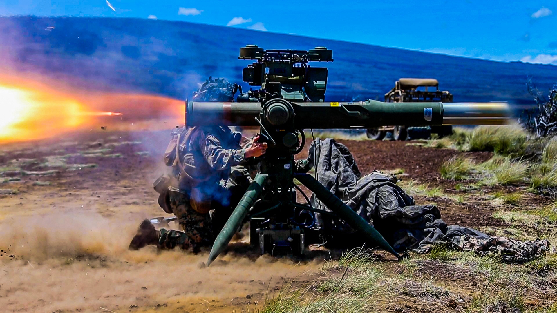 A U.S. Marine with 1st Battalion, 3rd Marines, fires a TOW missile during exercise Bougainville II at Pohakuloa Training Area, Hawaii, April 18, 2021. Bougainville II is the second phase of pre-deployment training conducted by the battalion designed to increase combat readiness through complex and realistic live-fire training. (U.S. Marine Corps photo by Cpl. Jacob Wilson)