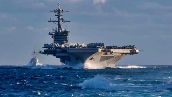PACIFIC OCEAN (Nov. 27, 2019) The Arleigh Burke-class guided-missile destroyer USS Russel (DDG 59) and the aircraft carrier USS Theodore Roosevelt (CVN 71) transit the Eastern Pacific Ocean Nov. 27, 2019. Paul Hamilton is underway conducting routine training in the Eastern Pacific Ocean. (U.S. Navy photo by Mass Communication Specialist 3rd Class Matthew F. Jackson)