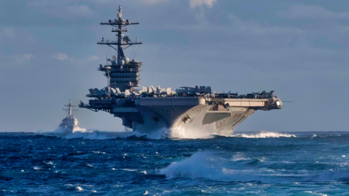 PACIFIC OCEAN (Nov. 27, 2019) The Arleigh Burke-class guided-missile destroyer USS Russel (DDG 59) and the aircraft carrier USS Theodore Roosevelt (CVN 71) transit the Eastern Pacific Ocean Nov. 27, 2019. Paul Hamilton is underway conducting routine training in the Eastern Pacific Ocean. (U.S. Navy photo by Mass Communication Specialist 3rd Class Matthew F. Jackson)