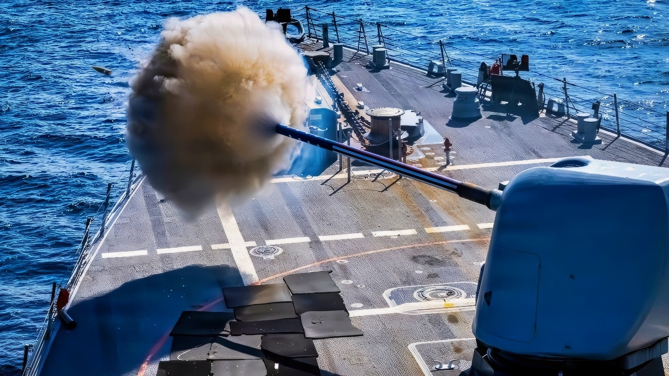 PACIFIC OCEAN (April 27, 2026) U.S. Navy Arleigh Burke-Class guided-missile destroyer USS John Paul Jones (DDG) 53, fires its Mk.45 5-inch deck cannon during a live fire exercise, April 27, 2026. John Paul Jones, part of the Theodore Roosevelt Carrier Strike Group, is underway in the U.S. 3rd Fleet area of operation conducting advanced training to bolster strike group readiness and capability. (U.S. Navy photo by Mass Communications Specialist 2nd Class Ryan Holloway)
