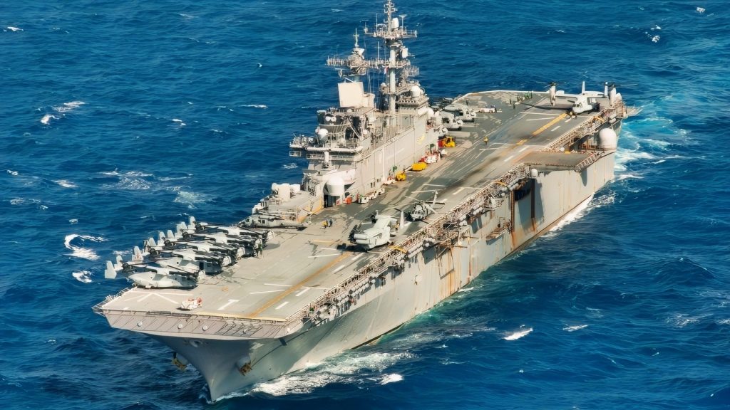 The amphibious assault ship USS Wasp (LHD 1) sails in the Philippine Sea Aug. 26, 2018 during a Passing Exercise (PASSEX) with the Japan Maritime Self Defense Force. PASSEX enabled the Wasp ARG and the JMSDF a chance to practice communications and maneuvering procedures. The Wasp Amphibious Ready Group is currently operating in the region to enhance interoperability with partners and serve as a ready-response force for any type of contingency. (U.S. Navy photo by Mass Communication Specialist 3rd Class Taylor King)
