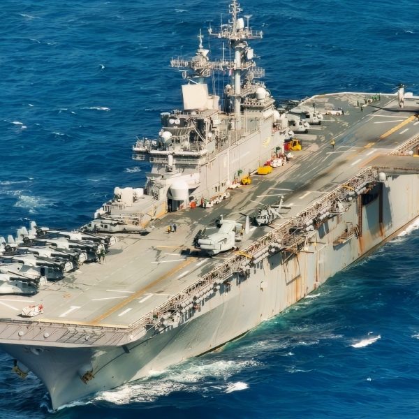 The amphibious assault ship USS Wasp (LHD 1) sails in the Philippine Sea Aug. 26, 2018 during a Passing Exercise (PASSEX) with the Japan Maritime Self Defense Force. PASSEX enabled the Wasp ARG and the JMSDF a chance to practice communications and maneuvering procedures. The Wasp Amphibious Ready Group is currently operating in the region to enhance interoperability with partners and serve as a ready-response force for any type of contingency. (U.S. Navy photo by Mass Communication Specialist 3rd Class Taylor King)
