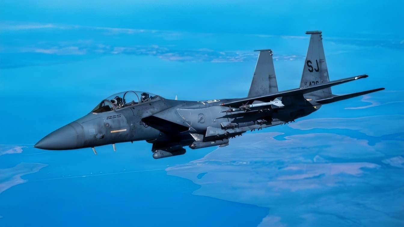 An F-15E Strike Eagle with the 4th Fighter Wing approaches a KC-135 Stratotanker from the 121st Air Refueling Wing to be refueled over the skies of North Carolina, Jan. 21, 2026. The F-15E is a versatile fighter jet built to handle both air-to-air and air-to-ground missions, equipped with advanced avionics and electronics that enable it to operate effectively at low altitudes, day or night, and in any weather. (U.S. Air National Guard photo by Airman Samir Harris)
