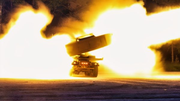U.S. Soldiers assigned to the Blackhawk Battery, 1st Battalion, 14th Field Artillery Regiment, 75th Field Artillery Brigade, fire an M142 High Mobility Artillery Rocket System during a night live fire training as part of Exercise Spring Storm 23 held at Camp Tapa, Estonia, May 25, 2023. (U.S. Army National Guard photo by Staff Sgt. Agustín Montañez)