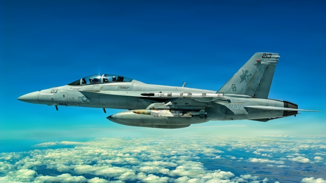 A Navy F/A-18 carries the new Joint Direct Attack Munition (JDAM) Long Range (LR) variant during a test event in early April off the coast of California (U.S. Navy photo/released)