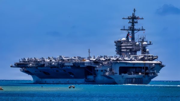 U.S. Navy Nimitz-class aircraft carrier USS Theodore Roosevelt (CVN 71) departs Joint Base Pearl Harbor-Hickam, Hawaii, to begin the sea phase of Exercise Rim of the Pacific 2026, July 7, 2026. Thirty nations, over 30 surface ships, five submarines, 15 national land forces, more than 206 aircraft and 30,000 personnel are participating in RIMPAC in and around the Hawaiian Islands, June 24 to July 31. The world's largest international maritime exercise, RIMPAC provides a unique training opportunity while fostering and sustaining cooperative relationships among participants critical to ensuring the safety of sea lanes and security on the world's oceans. RIMPAC 2026 is the 30th exercise in the series that began in 1971. (U.S. Navy photo by Mass Communication Specialist 1st Class Kyle Carlstrom)