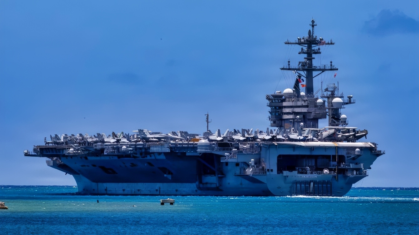 U.S. Navy Nimitz-class aircraft carrier USS Theodore Roosevelt (CVN 71) departs Joint Base Pearl Harbor-Hickam, Hawaii, to begin the sea phase of Exercise Rim of the Pacific 2026, July 7, 2026. Thirty nations, over 30 surface ships, five submarines, 15 national land forces, more than 206 aircraft and 30,000 personnel are participating in RIMPAC in and around the Hawaiian Islands, June 24 to July 31. The world's largest international maritime exercise, RIMPAC provides a unique training opportunity while fostering and sustaining cooperative relationships among participants critical to ensuring the safety of sea lanes and security on the world's oceans. RIMPAC 2026 is the 30th exercise in the series that began in 1971. (U.S. Navy photo by Mass Communication Specialist 1st Class Kyle Carlstrom)