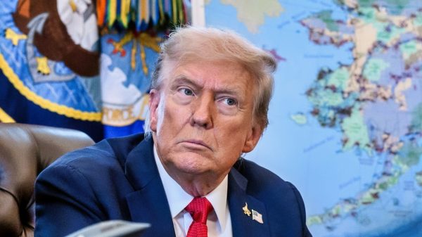 President Donald Trump, flanked by Secretary of Energy Chris Wright and Secretary of the Interior Doug Burgum, signs an Executive Order approving the Ambler Road Project in Alaska, Monday, October 6, 2025, in the Oval Office. (Official White House Photo by Joyce N. Boghosian)