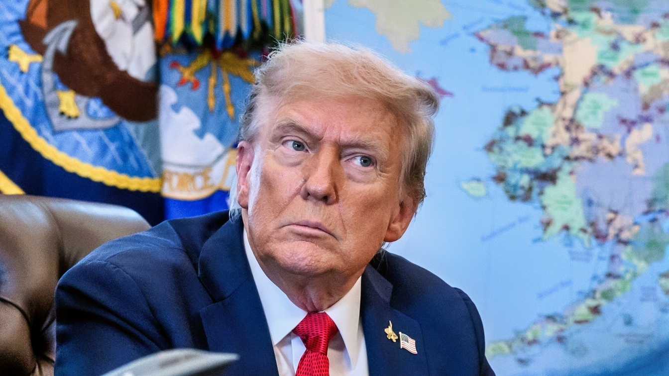 President Donald Trump, flanked by Secretary of Energy Chris Wright and Secretary of the Interior Doug Burgum, signs an Executive Order approving the Ambler Road Project in Alaska, Monday, October 6, 2025, in the Oval Office. (Official White House Photo by Joyce N. Boghosian)
