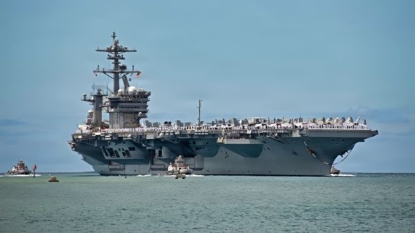 Nimitz-class aircraft carrier USS Theodore Roosevelt (CVN 71) arrives at Joint Base Pearl Harbor-Hickam, Hawaii, to participate in Exercise Rim of the Pacific 2026, June 23, 2026. Thirty-one nations, more than 36 surface ships, 5 submarines, 15 national land forces, more than 206 aircraft and 25,000 personnel are participating in RIMPAC in and around the Hawaiian Islands, June 24 to July 31. The world's largest international maritime exercise, RIMPAC provides a unique training opportunity while fostering and sustaining cooperative relationships among participants critical to ensuring the safety of sea lanes and security on the world's oceans. RIMPAC 2026 is the 30th exercise in the series that began in 1971. (U.S. Navy photo by Mass Communication Specialist 1st Class Erik Melgar)
