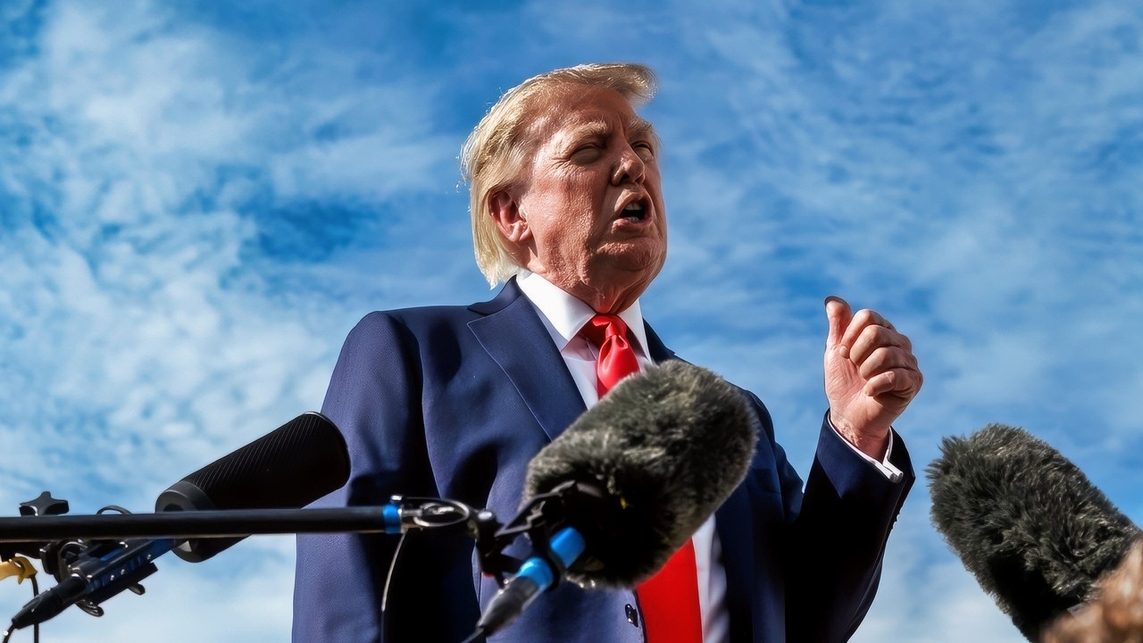 President Donald J. Trump speaks with members of the media alongside outgoing White House Press Secretary Karoline Leavitt, before boarding Air Force One at Joint Base Andrews, Maryland, Friday, August 21, 2026, en route to South Carolina. (Official White House Photo by Molly Riley)