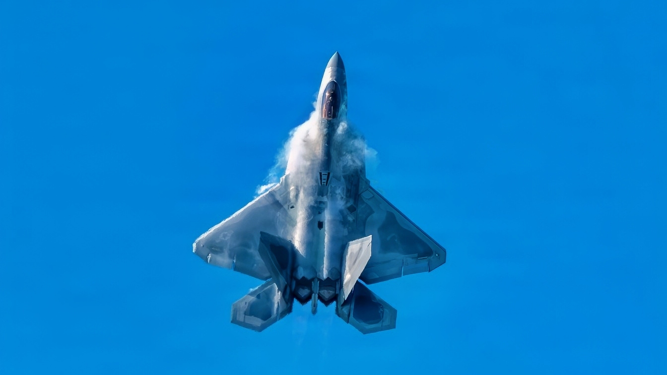 U.S Air Force Capt. Nick “Laz” Le Tourneau, F-22 Raptor Aerial Demonstration Team pilot and commander, performs an aerial demonstration at Naval Air Station Oceana Air Show, Virginia, Sept. 18, 2026. The visible vapor forms when rapid changes in air pressure and humidity around the aircraft cause water vapor in the air to condense. (U.S. Air Force photo by Airman 1st Class Kaden Ciminnisi)