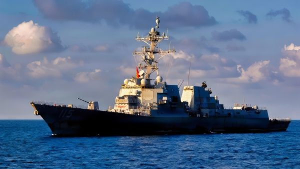 U.S. Sailors pilot a rigid-hull inflatable boat toward Arleigh Burke-class guided-missile destroyer USS Rafael Peralta (DDG 115), as seen from Arleigh Burke-class guided-missile destroyer USS Milius (DDG 69), Oct. 2, 2026. Milius and Rafael Peralta are deployed to the U.S. 5th Fleet area of operations to support maritime security and stability in the Middle East. (U.S. Navy photo)
