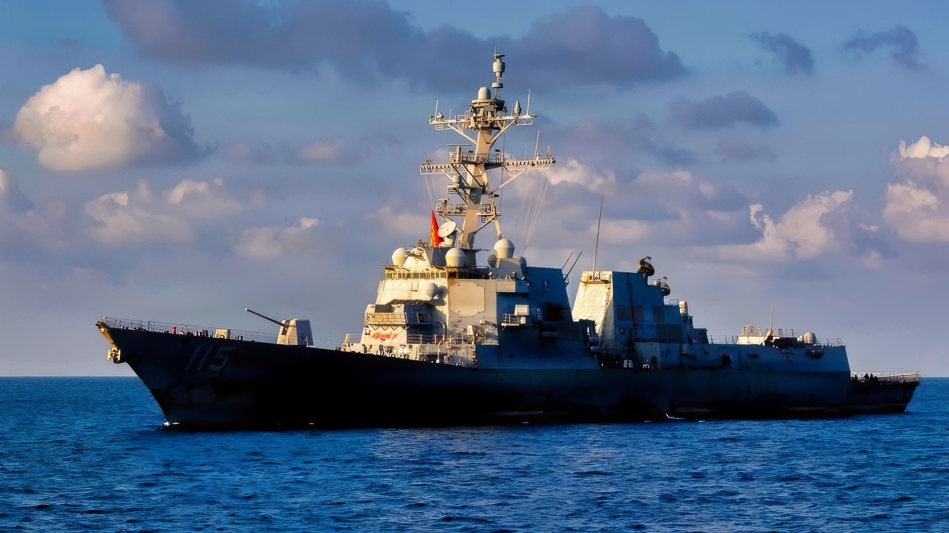 U.S. Sailors pilot a rigid-hull inflatable boat toward Arleigh Burke-class guided-missile destroyer USS Rafael Peralta (DDG 115), as seen from Arleigh Burke-class guided-missile destroyer USS Milius (DDG 69), Oct. 2, 2026. Milius and Rafael Peralta are deployed to the U.S. 5th Fleet area of operations to support maritime security and stability in the Middle East. (U.S. Navy photo)